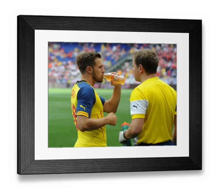 Framed Print : Arsenal's Aaron Ramsey Consults Team Physio Colin Lewin Before New York Red Bulls Clash Framed Print : Arsenal's Aaron Ramsey Consults Team Physio Colin Lewin Before New York Red Bulls Clash