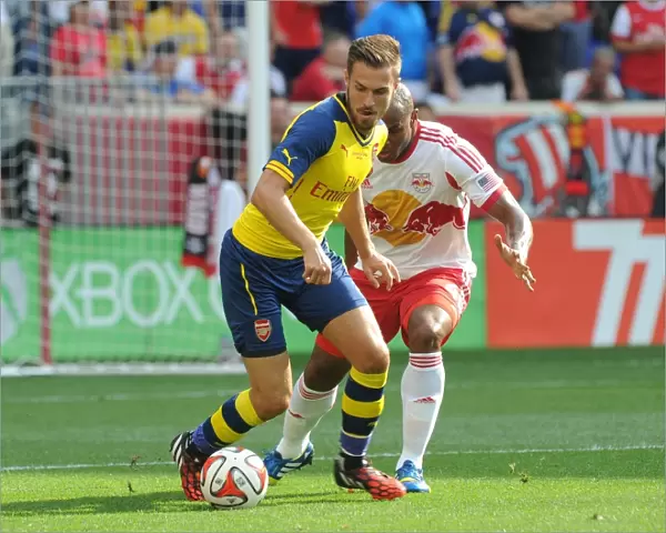 Arsenal's Aaron Ramsey Fends Off Jamison Olave in 2014 Pre-Season Clash