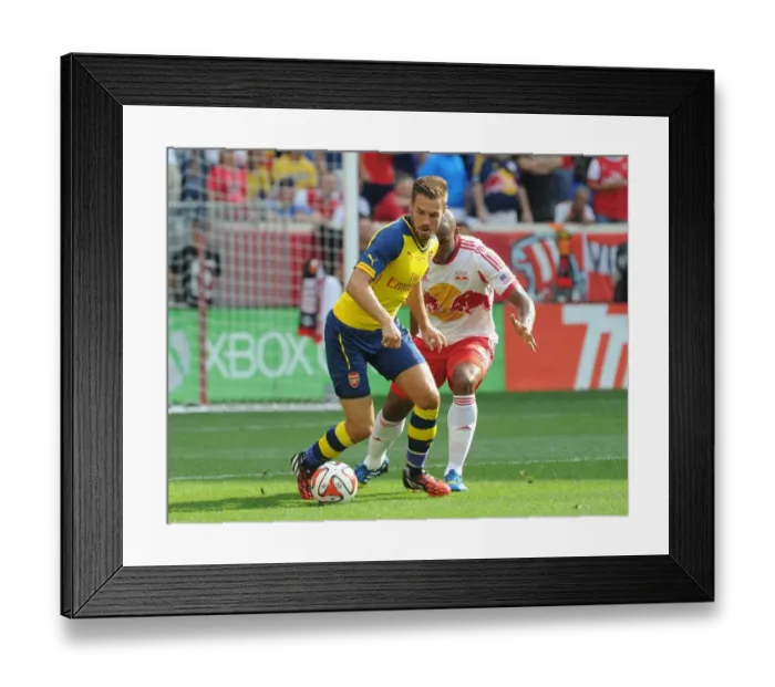 Framed Print : Arsenal's Aaron Ramsey Fends Off Jamison Olave in 2014 Pre-Season Clash Framed Print : Arsenal's Aaron Ramsey Fends Off Jamison Olave in 2014 Pre-Season Clash
