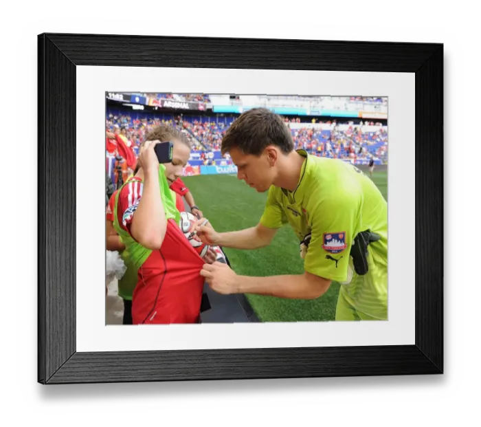 Framed Print : Wojciech Szczesny Interacts with Ball Girl at Arsenal's Pre-Season Friendly vs New York Red Bulls Framed Print : Wojciech Szczesny Interacts with Ball Girl at Arsenal's Pre-Season Friendly vs New York Red Bulls