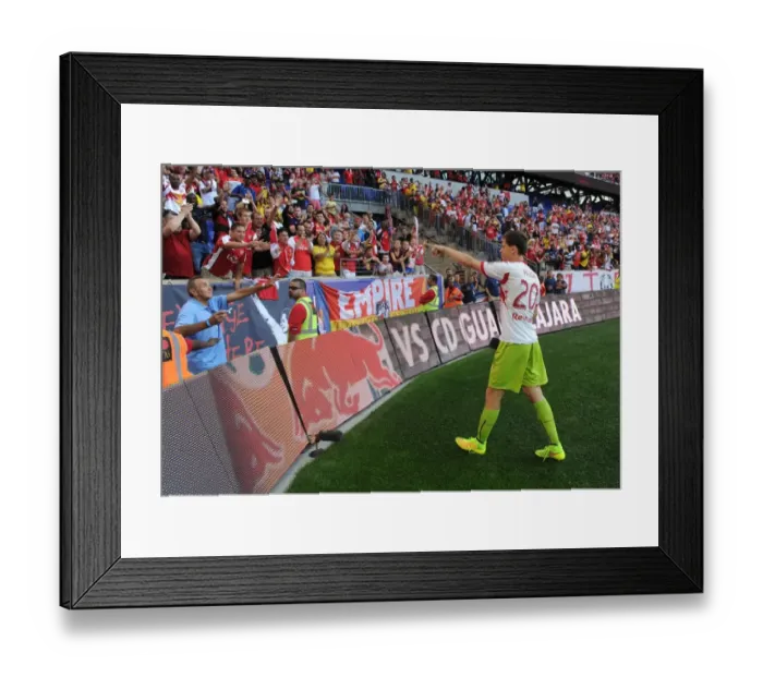 Framed Print : Wojciech Szczesny Gifts Gloves to Fan after Arsenal's Pre-Season Win over New York Red Bulls
