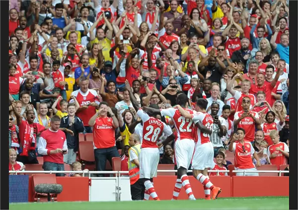 Joel Campbell celebrates scoring Arsenals 2nd goal with the fans. Arsenal 5: 1 Benfica