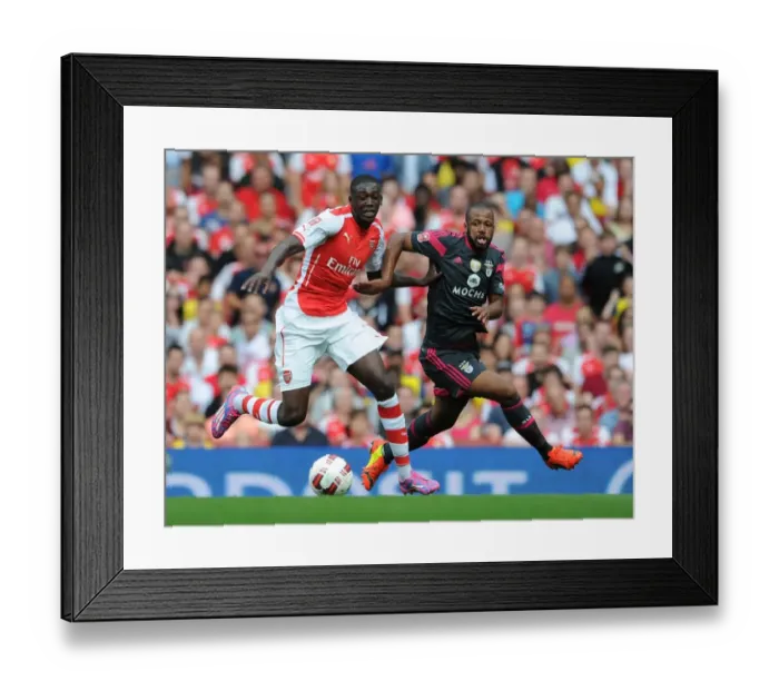Framed Print : Arsenal's Yaya Sanogo Battles Past Benfica's Eliseu in 2014-15 Emirates Cup Clash Framed Print : Arsenal's Yaya Sanogo Battles Past Benfica's Eliseu in 2014-15 Emirates Cup Clash