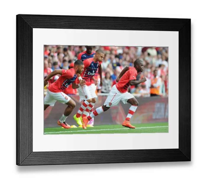 Framed Print : Arsenal's Joel Campbell Faces Off Against Benfica at the Emirates Cup