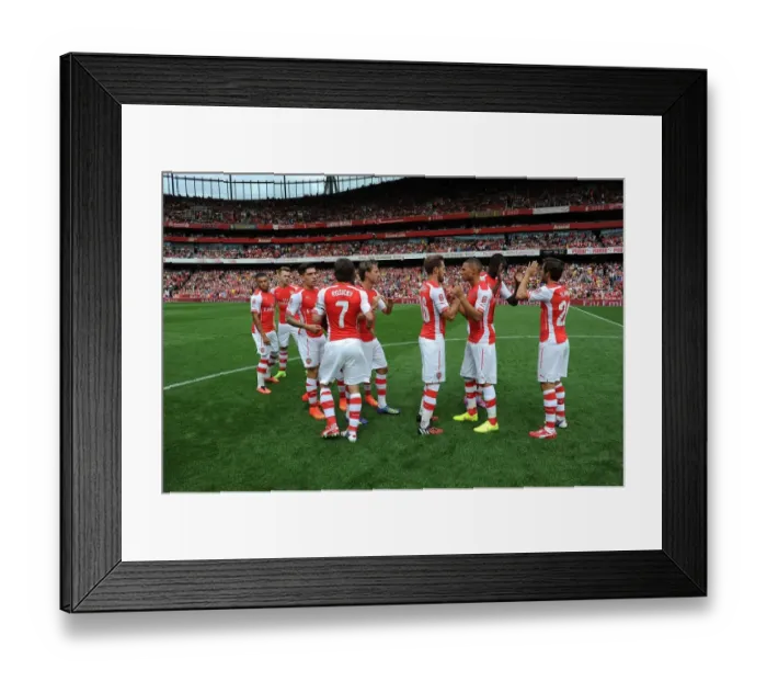 Framed Print : LONDON, ENGLAND - AUGUST 02: The Arsenal team line up before the match between Arsenal