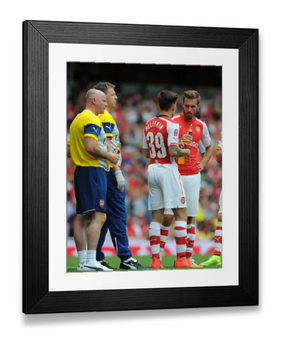 Framed Print : Arsenal Training Room: Bellerin and Ramsey Receive Treatment during Arsenal v Benfica Emirates Cup Match