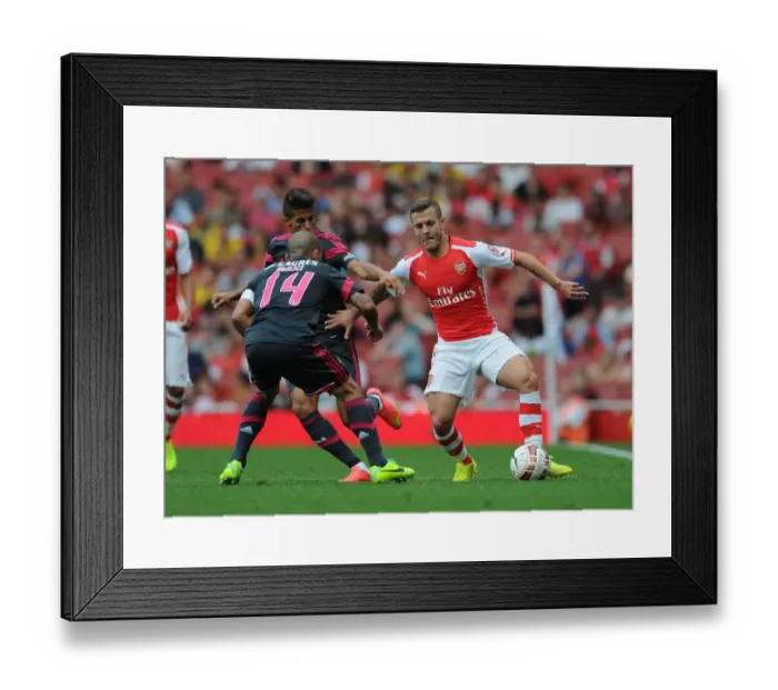 Framed Print : Arsenal's Jack Wilshere Clashes with Benfica's Maxi Pereira in Emirates Cup Showdown