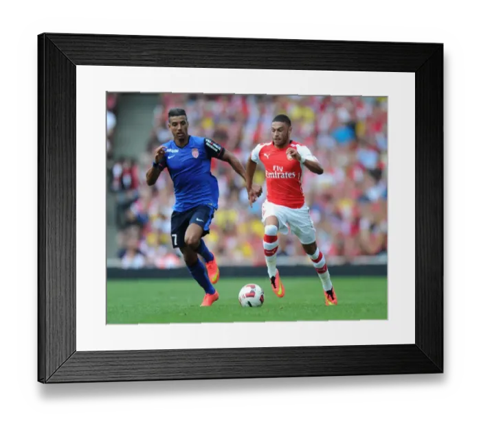 Framed Print : Arsenal's Alex Oxlade-Chamberlain Outmaneuvers AS Monaco's Nabil Dirar Framed Print : Arsenal's Alex Oxlade-Chamberlain Outmaneuvers AS Monaco's Nabil Dirar