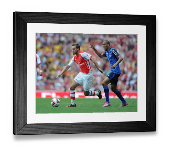 Framed Print : Arsenal's Ramsey Outmaneuvers Monaco's Fabinho in Emirates Cup Clash
