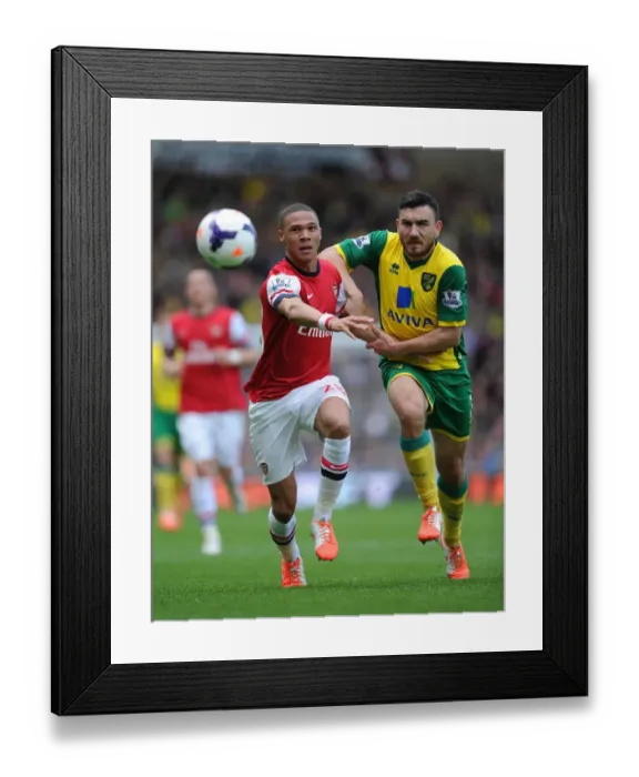 Framed Print : Clash at Carrow Road: Gibbs vs. Snodgrass - Norwich City vs. Arsenal, Premier League 2013-14 Framed Print : Clash at Carrow Road: Gibbs vs. Snodgrass - Norwich City vs. Arsenal, Premier League 2013-14