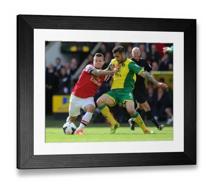 Framed Print : Jack Wilshere vs. Bradley Johnson: Intense Battle in Norwich City vs. Arsenal (2013-14)