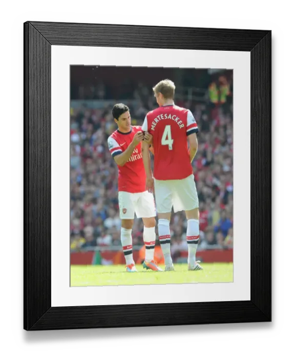 Framed Print : Mikel Arteta hands the captains armband to Per Mertesacker (Arsenal). Arsenal 1: 0 Framed Print : Mikel Arteta hands the captains armband to Per Mertesacker (Arsenal). Arsenal 1: 0