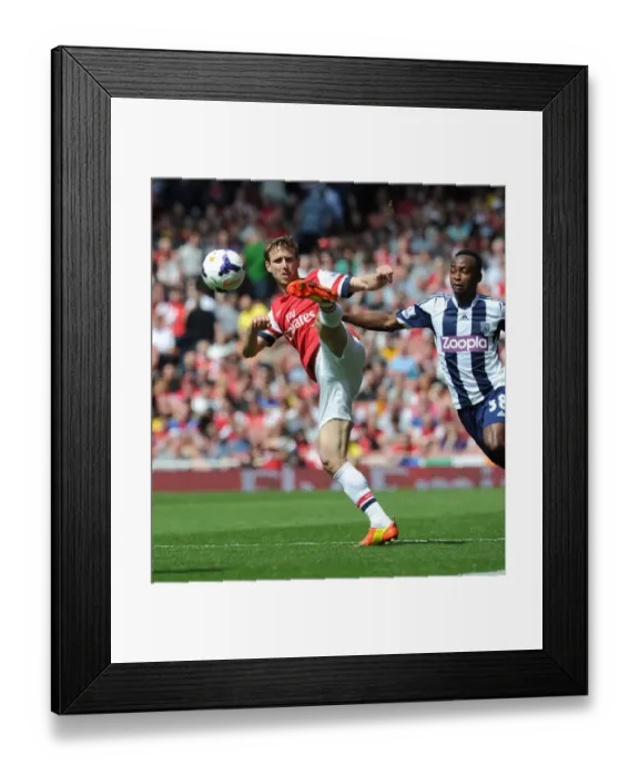Framed Print : Monreal vs. Berahino: A Tense Face-Off at Emirates Stadium - Arsenal vs. West Bromwich Albion (2013-14) Framed Print : Monreal vs. Berahino: A Tense Face-Off at Emirates Stadium - Arsenal vs. West Bromwich Albion (2013-14)