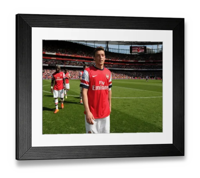 Framed Print : Arsenal's Mesut Ozil Before Arsenal v West Bromwich Albion, Premier League 2013-14