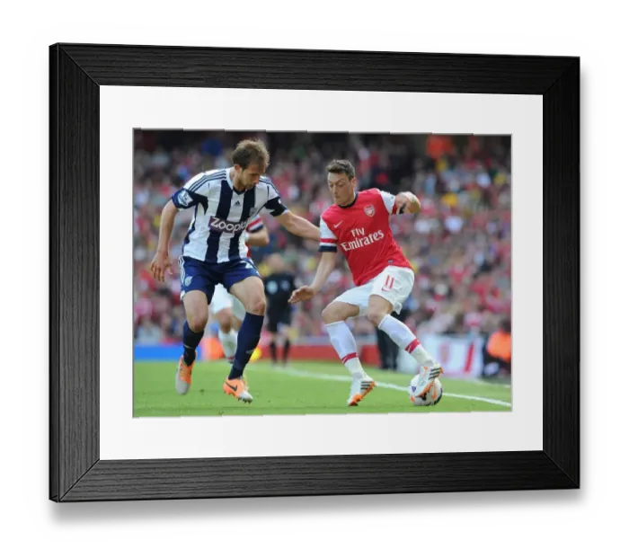 Framed Print : Mesut Ozil vs Diego Lugano: Arsenal vs West Bromwich Albion, Premier League Showdown (2013-14)
