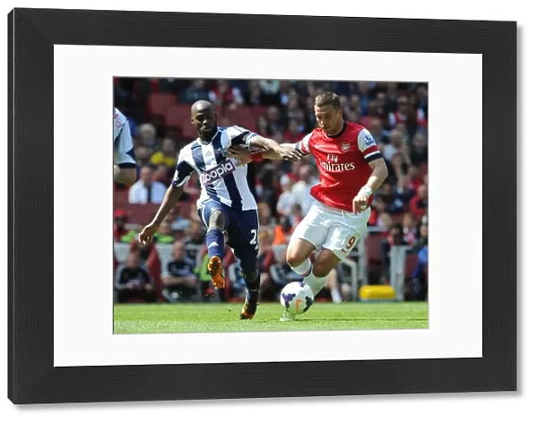Lukas Podolski (Arsenal) Yousouf Mulumbu (WBA). Arsenal 1: 0 West Bromwich Albion