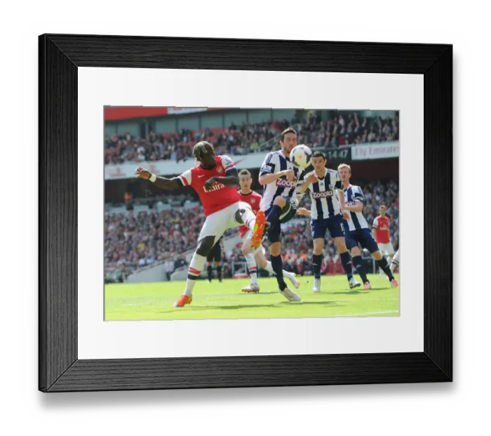 Framed Print : Battling for Possession: Sagna vs Amalfitano in Arsenal vs West Bromwich Albion (2013-14)