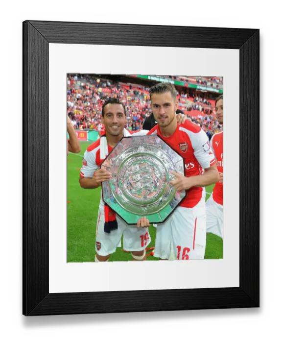 Framed Print : Arsenal's Cazorla and Ramsey Celebrate FA Community Shield Victory over Manchester City