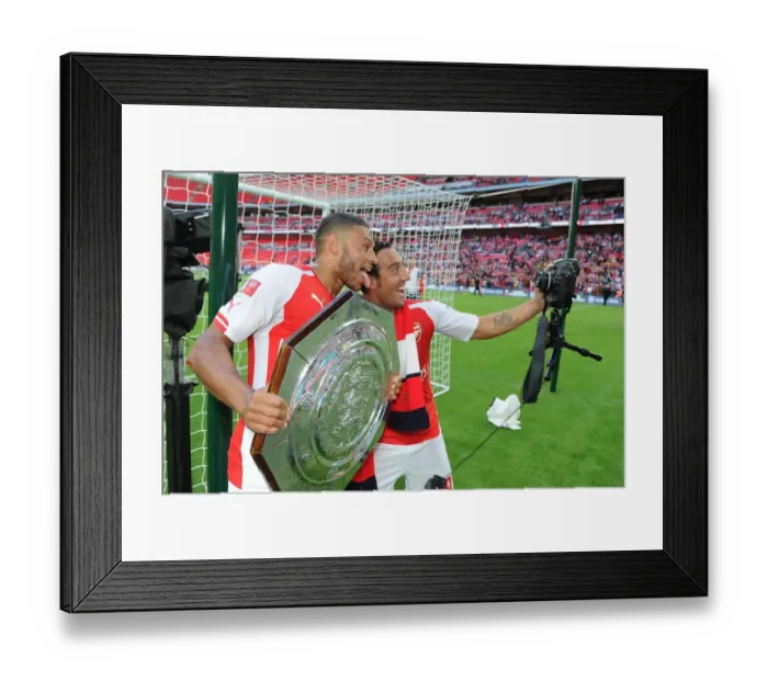 Framed Print : Clash of the Stars: Oxlade-Chamberlain vs. Cazorla in Arsenal's FA Community Shield Battle against Manchester City