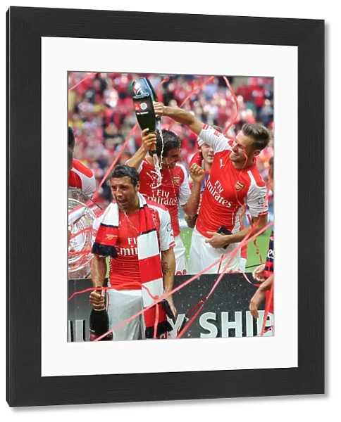 Aaron Ramsey and Santi Cazorla (Arsenal) celebrate winning the community shield. Arsenal 3