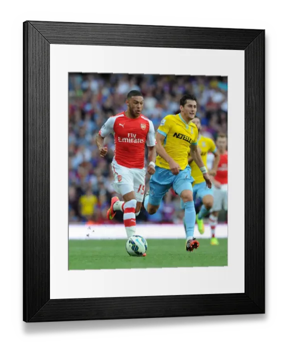 Framed Print : Arsenal's Alex Oxlade-Chamberlain vs. Crystal Palace's Joel Ward: A Football Showdown