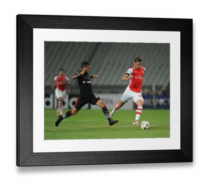 Framed Print : Giroud vs Motta: Arsenal's Olivier Giroud Clashes with Besiktas Ramon Motta in UEFA Champions League Qualifier Framed Print : Giroud vs Motta: Arsenal's Olivier Giroud Clashes with Besiktas Ramon Motta in UEFA Champions League Qualifier