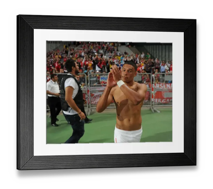 Framed Print : Alex Oxlade-Chamberlain Celebrates with Arsenal Fans after First Leg of Besiktas vs Arsenal UEFA Champions League Play-Offs Framed Print : Alex Oxlade-Chamberlain Celebrates with Arsenal Fans after First Leg of Besiktas vs Arsenal UEFA Champions League Play-Offs