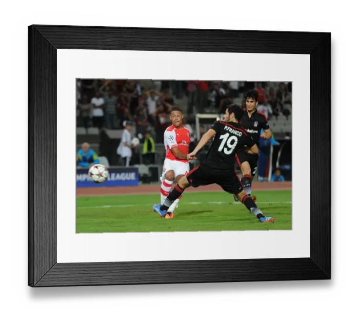 Framed Print : Alexis Sanchez Faces Off Against Pedro Franco: Tense Moment in Arsenal's UEFA Champions League Clash with Besiktas