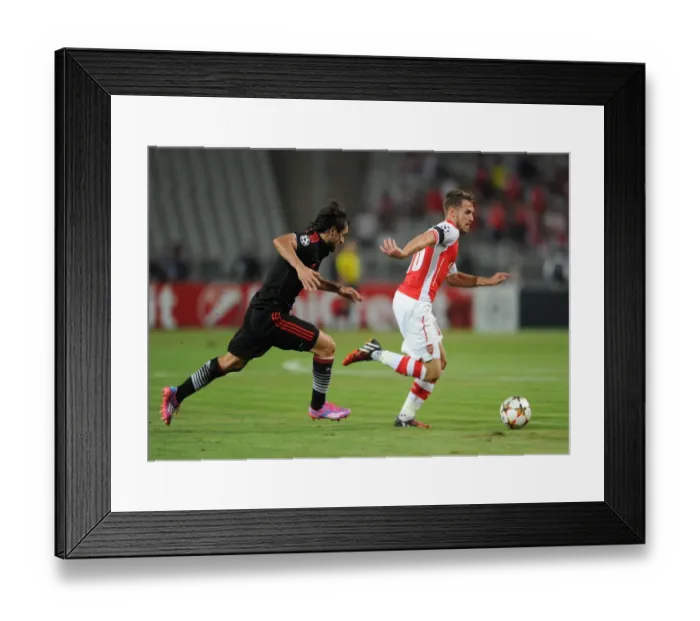 Framed Print : Aaron Ramsey (Arsenal) Veli Kavlak (Besiktas). Besiktas 0: 0 Arsenal. UEFA Champions Framed Print : Aaron Ramsey (Arsenal) Veli Kavlak (Besiktas). Besiktas 0: 0 Arsenal. UEFA Champions