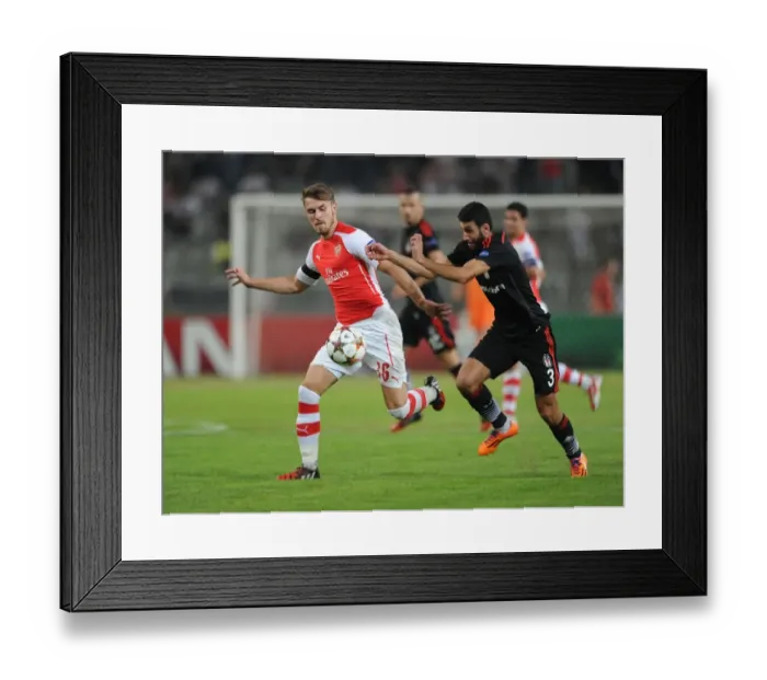 Framed Print : Aaron Ramsey vs. Ismail Koybasi: A Battle in the 2014 Champions League Qualifier Framed Print : Aaron Ramsey vs. Ismail Koybasi: A Battle in the 2014 Champions League Qualifier