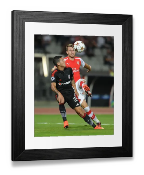 Framed Print : Aaron Ramsey vs. Ramon Motta: Battle in Istanbul - Arsenal vs. Besiktas, UEFA Champions League Qualifiers 2014 Framed Print : Aaron Ramsey vs. Ramon Motta: Battle in Istanbul - Arsenal vs. Besiktas, UEFA Champions League Qualifiers 2014