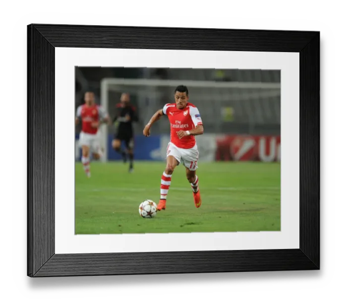 Framed Print : Alexis Sanchez: Arsenal's Star Forward in Action against Besiktas, UEFA Champions League Qualifier (2014)
