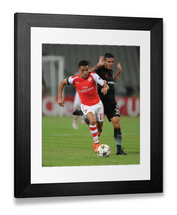 Framed Print : Alexis Sanchez (Arsenal) Ramon Motta (Besiktas). Besiktas 0: 0 Arsenal. UEFA Champions Framed Print : Alexis Sanchez (Arsenal) Ramon Motta (Besiktas). Besiktas 0: 0 Arsenal. UEFA Champions