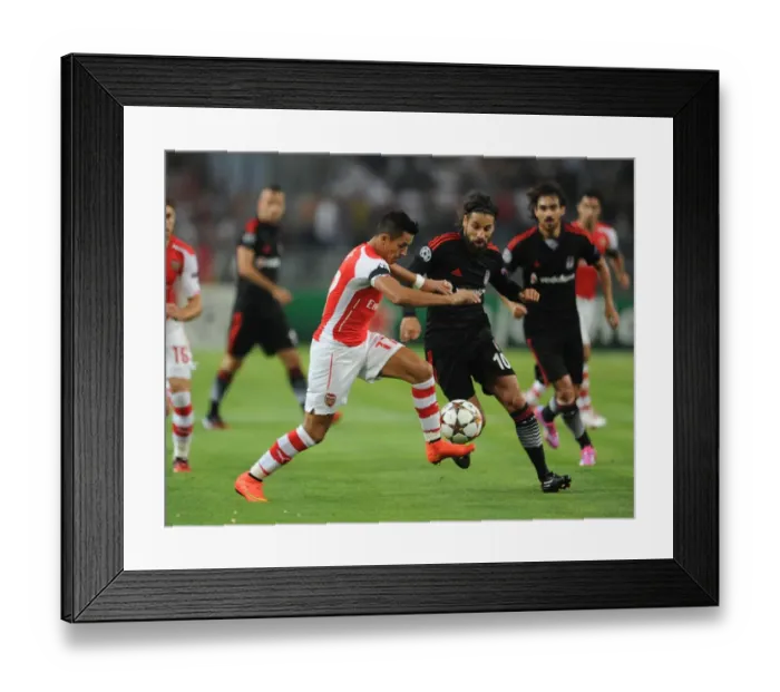 Framed Print : Clash of Stars: Sanchez vs. Sahan in Arsenal's UEFA Champions League Battle against Besiktas Framed Print : Clash of Stars: Sanchez vs. Sahan in Arsenal's UEFA Champions League Battle against Besiktas
