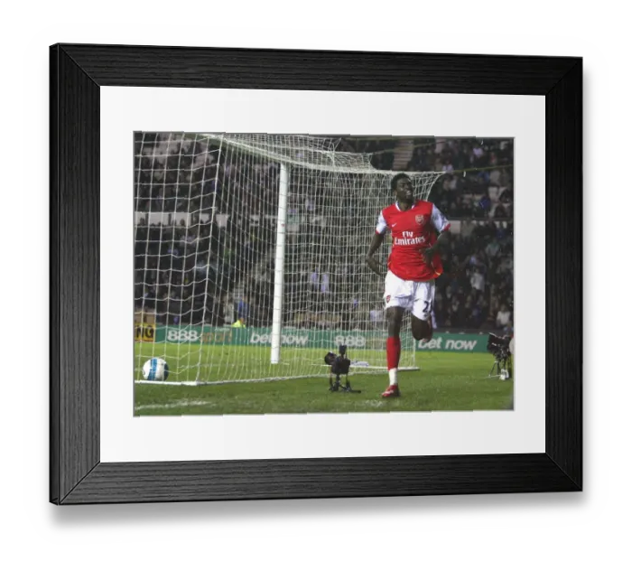 Framed Print : Emmanuel Adebayor celebrates scoring his 3rd and Arsenals 6th goal of the match
