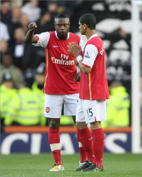 Arsenal captain William Gallas talks with Denilson before the match