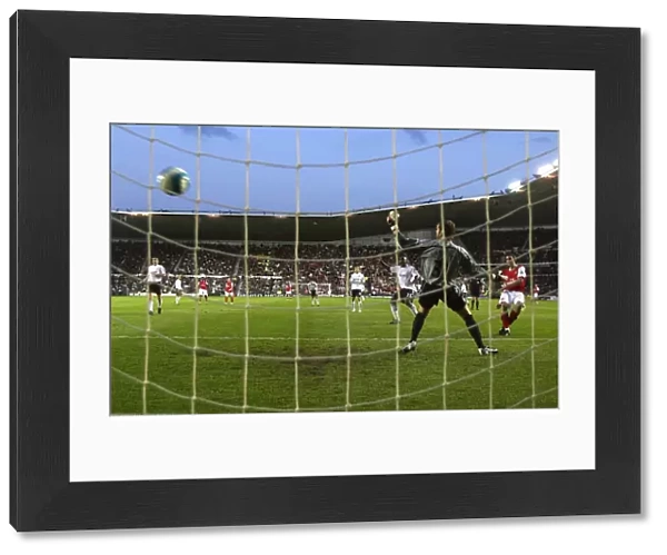 Robin van Persie shoots past Derby goalkeeper Roy Carroll to score the 2nd Arsenal goal