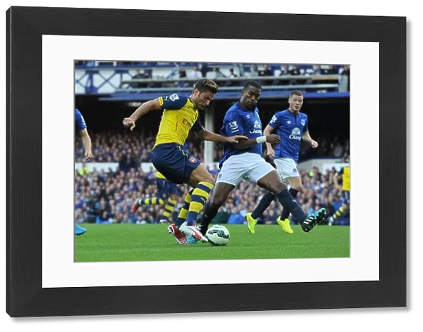 Olivier Giroud (Arsenal) Sylvain Distin (Everton). Everton 2: 2 Arsenal. Barclays Premier League