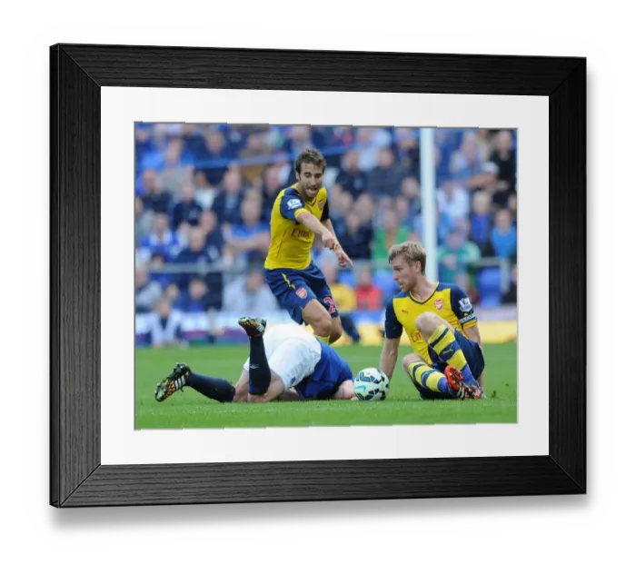 Framed Print : Per Mertesacker and Mathieu Flamini Challenge Steven Naismith in Intense Everton vs. Arsenal Premier League Clash