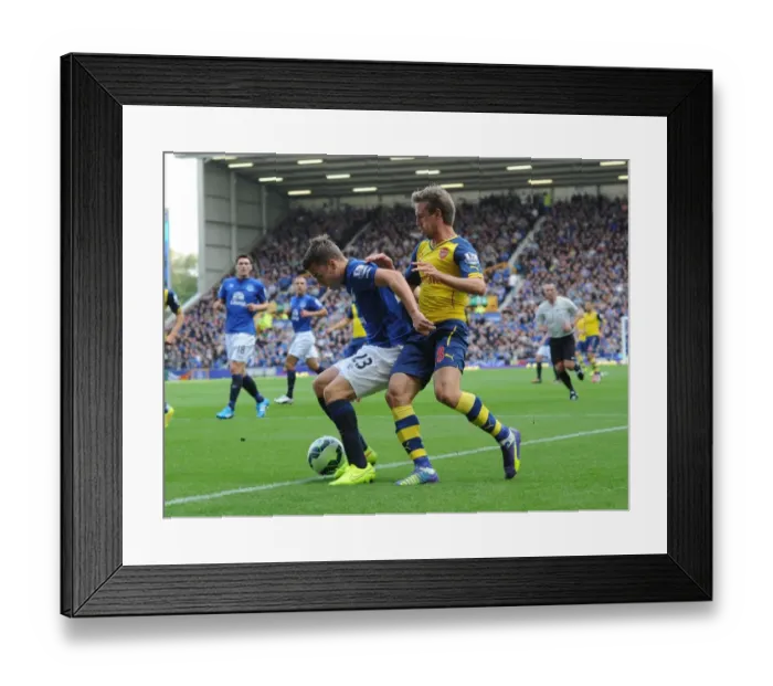 Framed Print : Nacho Monreal (Arsenal) Seamus Coleman (Everton). Everton 2: 2 Arsenal. Barclays Premier League Framed Print : Nacho Monreal (Arsenal) Seamus Coleman (Everton). Everton 2: 2 Arsenal. Barclays Premier League