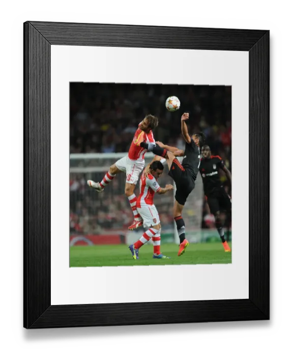 Framed Print : Arsenal FC vs Besiktas JK: Flamini and Cazorla Clash in UEFA Champions League Qualifier Framed Print : Arsenal FC vs Besiktas JK: Flamini and Cazorla Clash in UEFA Champions League Qualifier