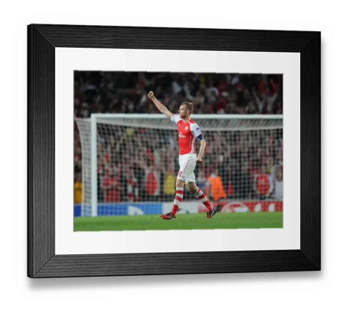 Framed Print : Per Mertesacker's Celebration: Arsenal FC Secures Champions League Spot against Besiktas Framed Print : Per Mertesacker's Celebration: Arsenal FC Secures Champions League Spot against Besiktas