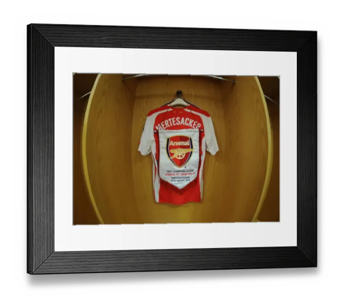 Framed Print : Per Mertesacker's Arsenal Shirt in Arsenal Changing Room Before UCL Match against Besiktas (2014)