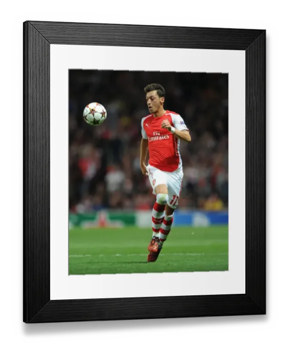 Framed Print : Mesut Ozil in Action: Arsenal vs Besiktas, UEFA Champions League Qualifiers 2014