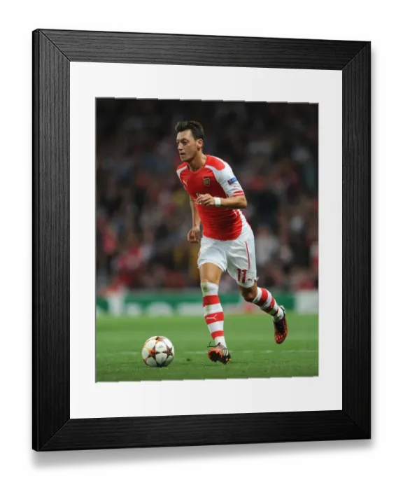 Framed Print : Mesut Ozil in Action: Arsenal vs Besiktas, UEFA Champions League (2014)