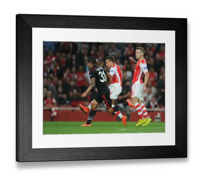 Framed Print : Alexis Sanchez Scores Dramatic Goal Against Ramon Motta in Arsenal's UEFA Champions League Showdown with Besiktas Framed Print : Alexis Sanchez Scores Dramatic Goal Against Ramon Motta in Arsenal's UEFA Champions League Showdown with Besiktas