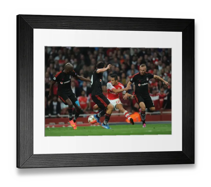 Framed Print : Arsenal's Alexis Sanchez Faces Off Against Besiktas Trio in 2014 Champions League Qualifier