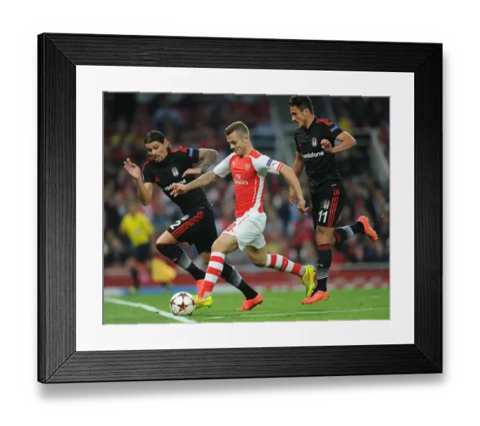 Framed Print : Arsenal's Jack Wilshere Clashes with Besiktas's Mustafa Pektemek and Ersan Gulum in UEFA Champions League Qualifier