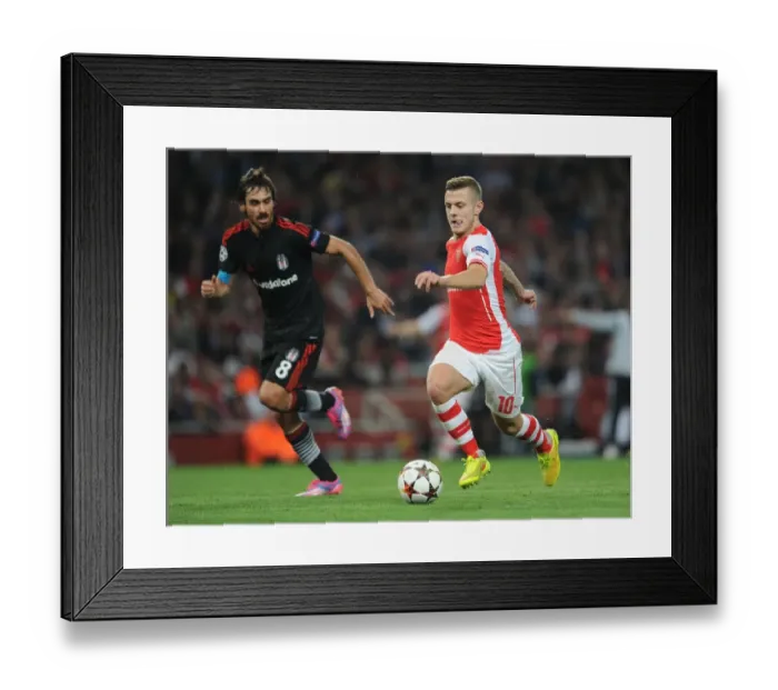 Framed Print : Arsenal's Jack Wilshere Clashes with Besiktas Veli Kavlak in UEFA Champions League Qualifier