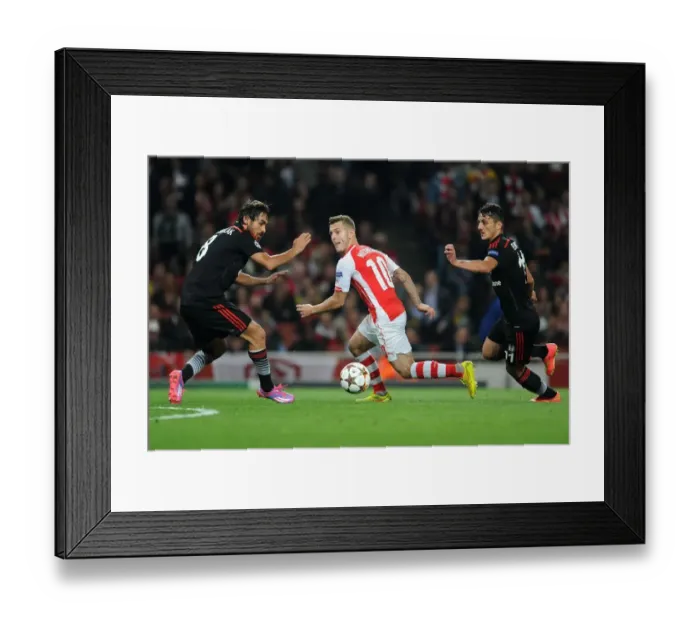 Framed Print : Arsenal's Jack Wilshere Goes Head-to-Head with Mustafa Pektemek and Ersan Gulum in Intense UEFA Champions League Showdown Framed Print : Arsenal's Jack Wilshere Goes Head-to-Head with Mustafa Pektemek and Ersan Gulum in Intense UEFA Champions League Showdown